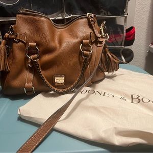 Excellent Condition. Tan with red interior.